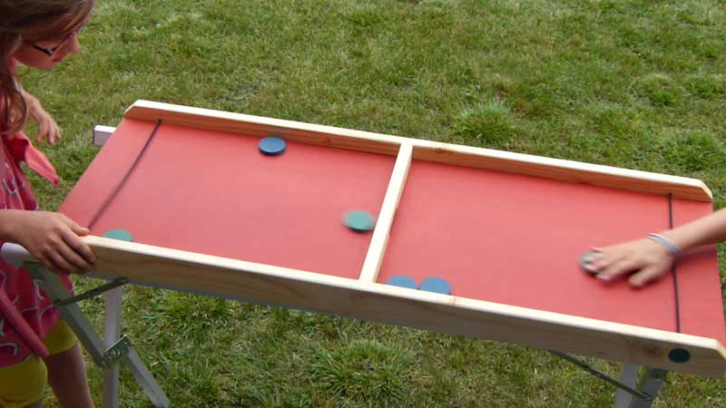 jeu en bois enfant passe-trappe table à élastiques